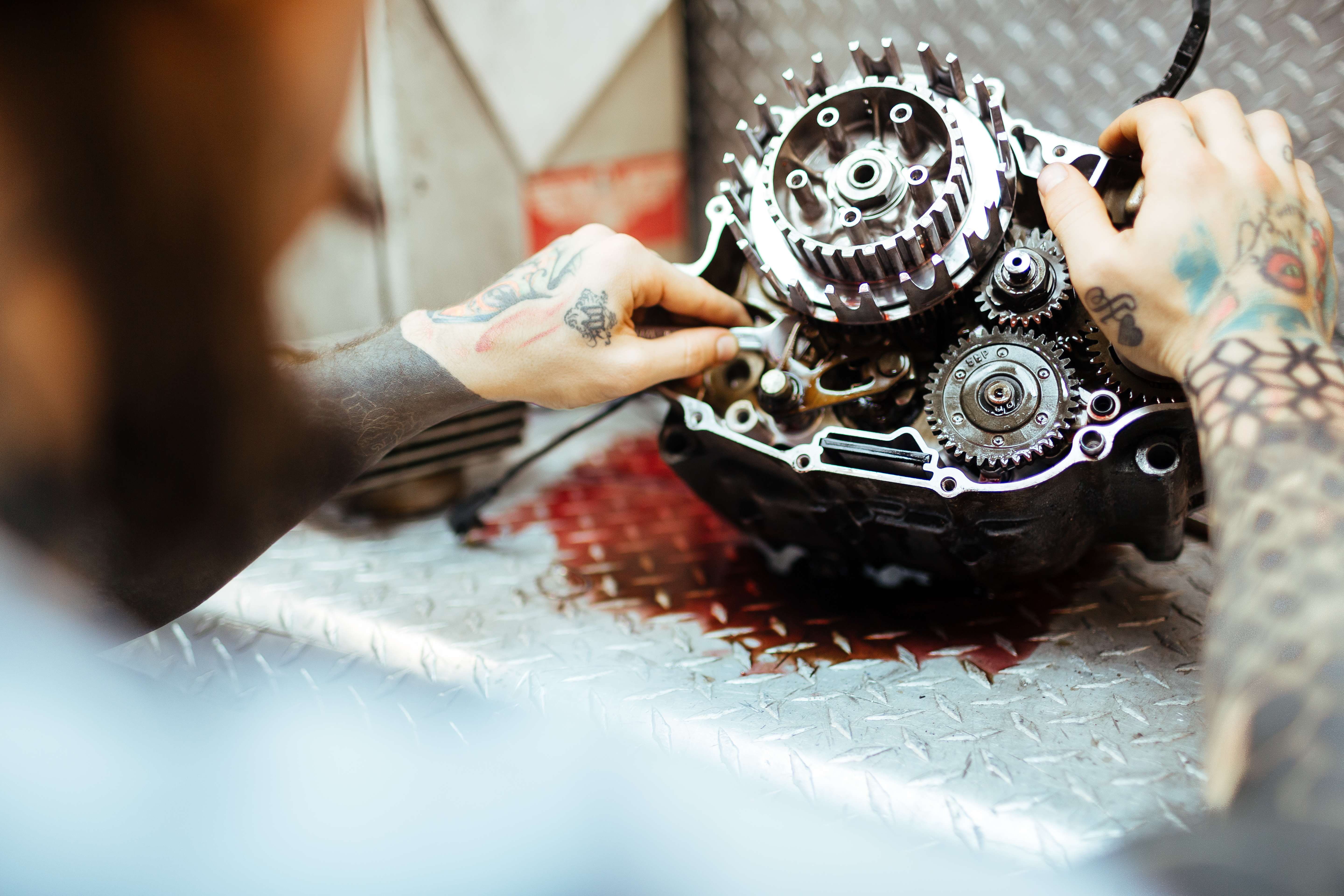 Mechanic checking motorcycle components